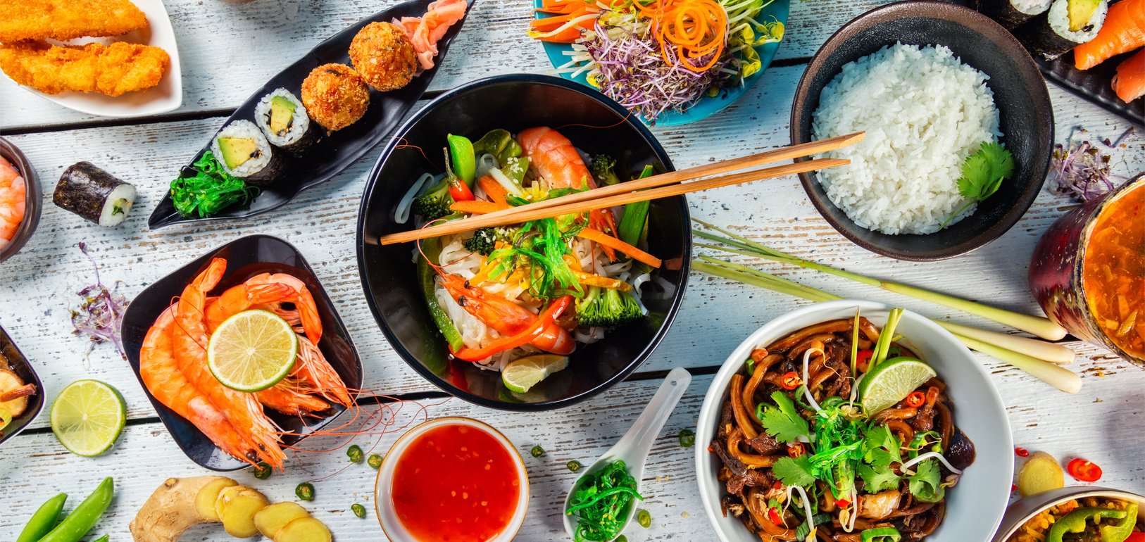 Asian Food Served on Wooden Table 